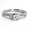 18k WG Round Center Engagement Ring w/ Baguette and Round Sidestones .61 ct center, 0.25ct side